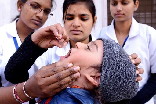 An Indian child receives polio vaccination drops An Indian child receives polio vaccination drops from a medical volunteer during an immunisation programme in Amritsar on January 19, 2014 (AFP/File, Narinder Nanu)